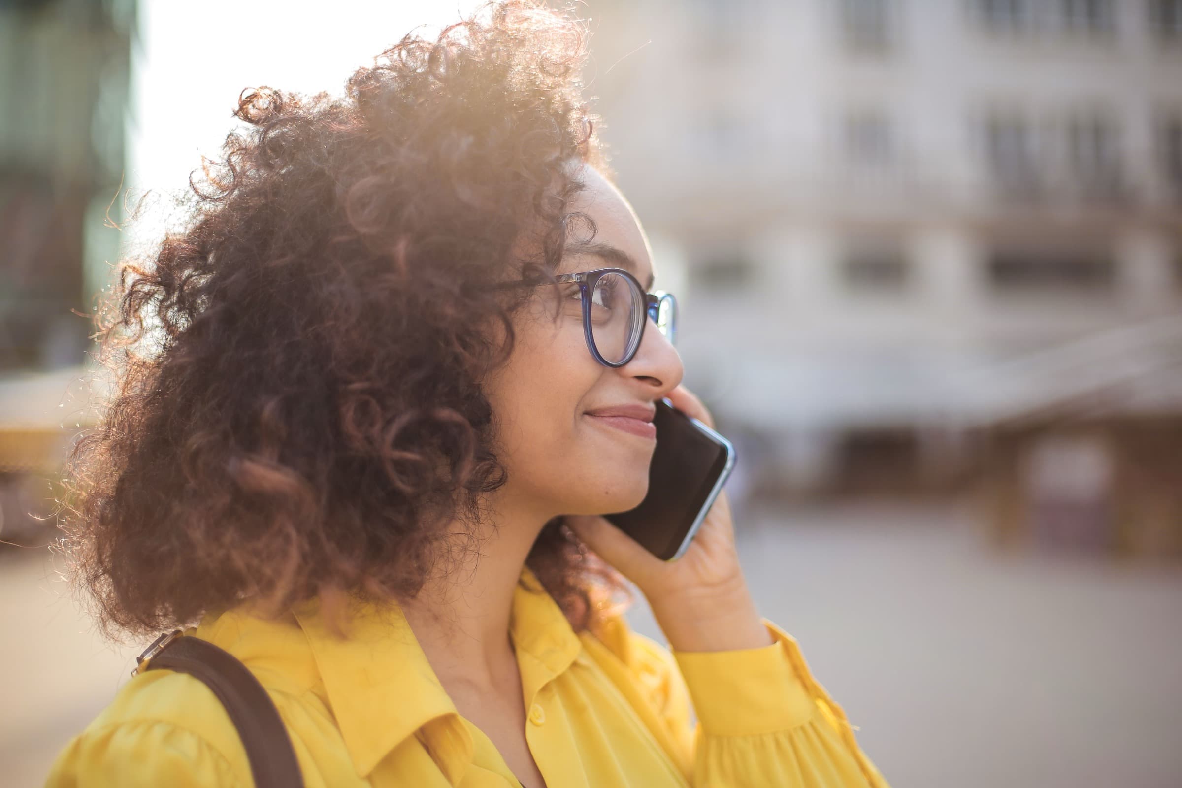 A woman making a phone call outdoors